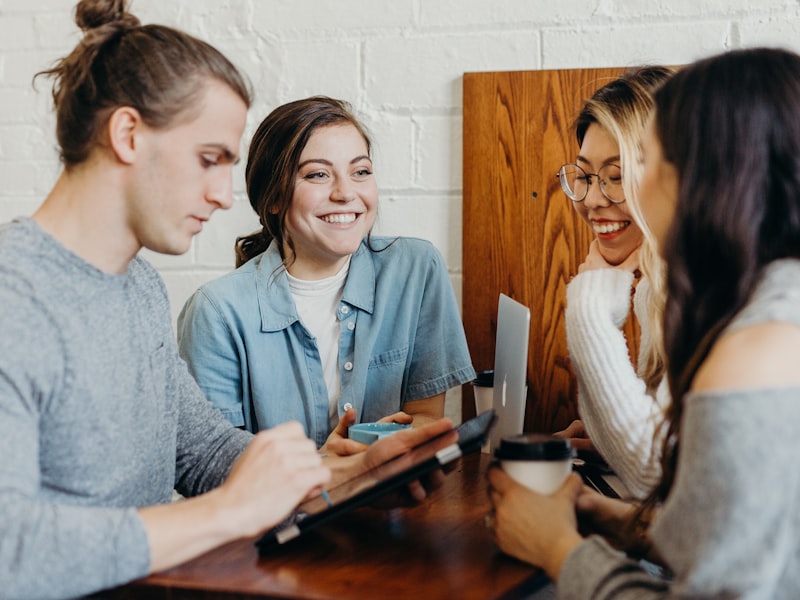 A small group reviewing their finances together and smiling